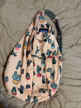 Kavu Peach Cactus Print Rope Sling Bag with Teal Accents